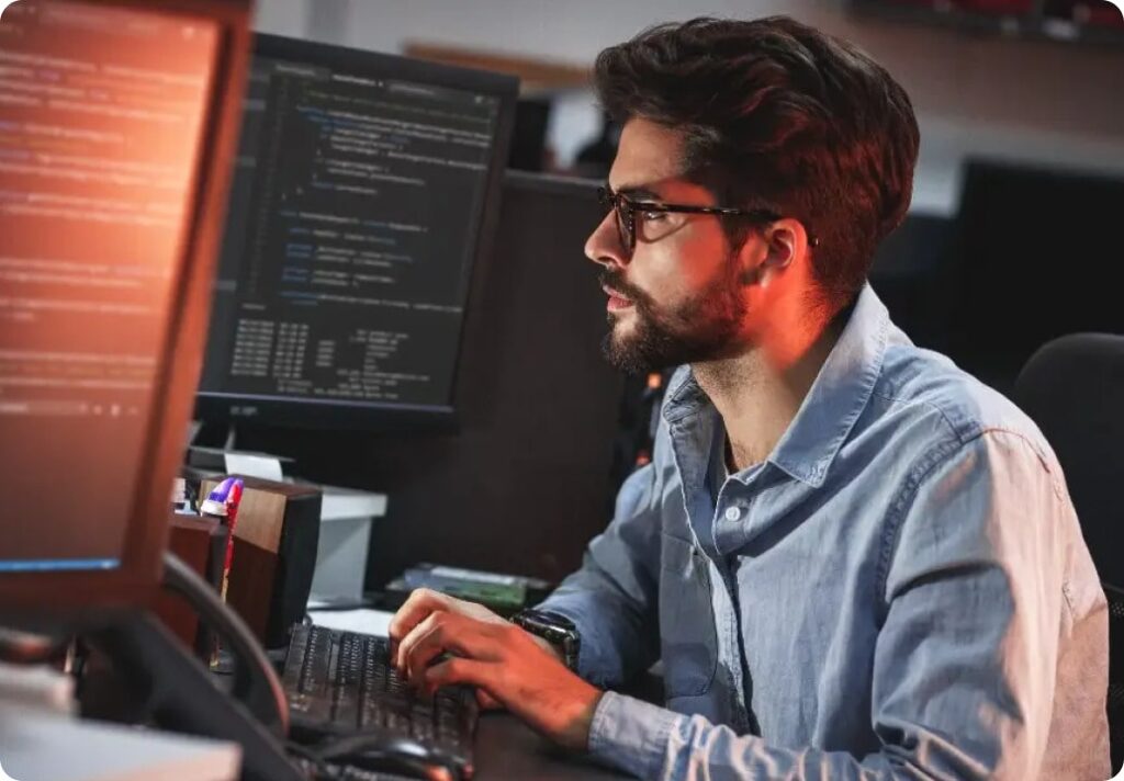 man working on backend of software program